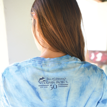 Load image into Gallery viewer, blue tie dye shirt back dolphin project logo